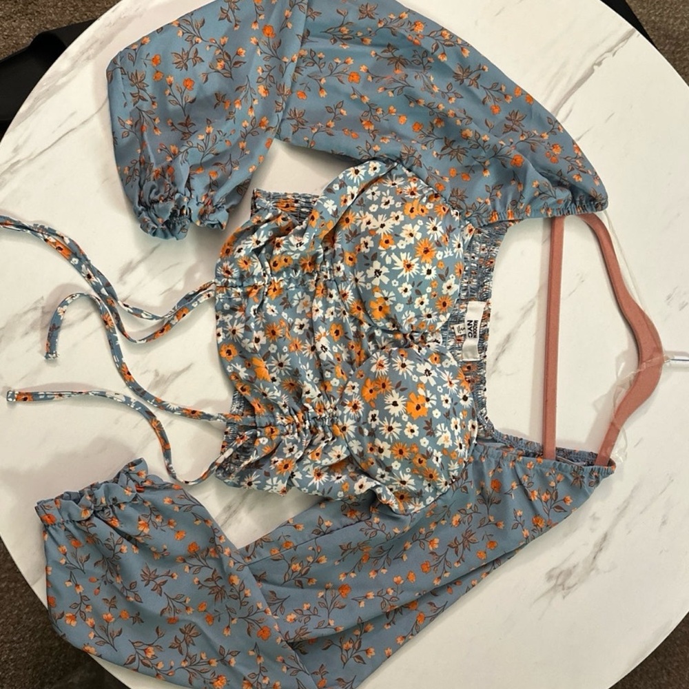 Blue and flowered blouse